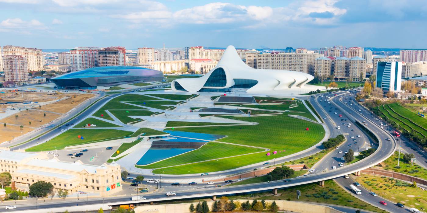 The modern, curved architecture of a Heydar Aliyev Cultural Center in Azerbaijan